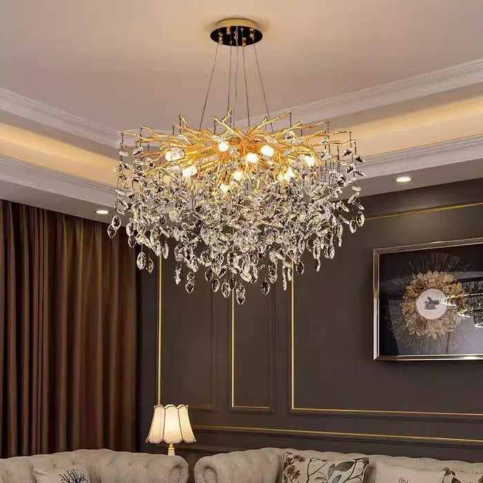 LUSTRE NIDOYA DORE EN CRISTAL AVEC CABLES REGLABLES 12 AMPOULES LED E14 INCLUS 12W, 220V, CLASSE IP 20 - image 1