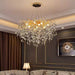 LUSTRE NIDOYA DORE EN CRISTAL AVEC CABLES REGLABLES 12 AMPOULES LED E14 INCLUS 12W, 220V, CLASSE IP 20 - image 1